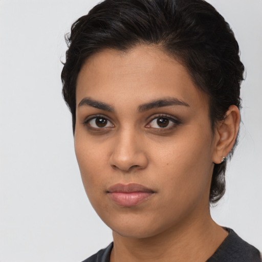 Neutral latino young-adult female with short  brown hair and brown eyes