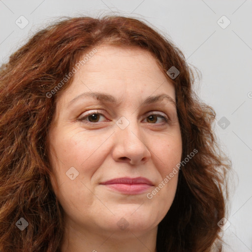 Joyful white adult female with long  brown hair and brown eyes