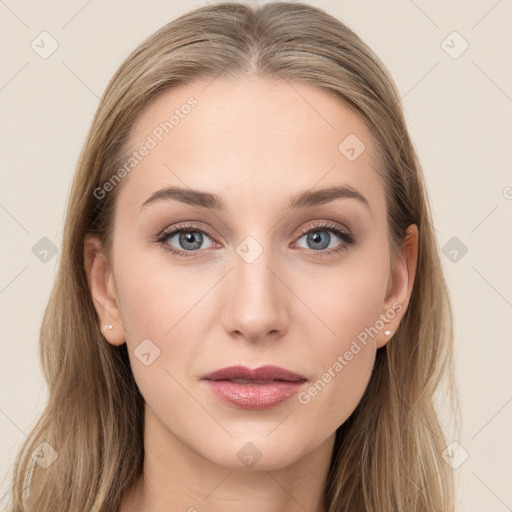 Joyful white young-adult female with long  brown hair and blue eyes