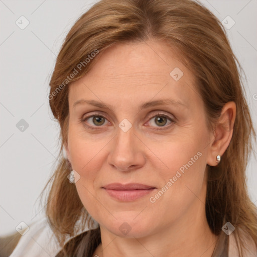 Joyful white adult female with medium  brown hair and grey eyes