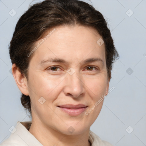 Joyful white adult female with short  brown hair and brown eyes