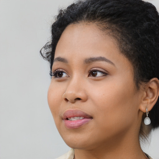 Neutral latino young-adult female with long  black hair and brown eyes