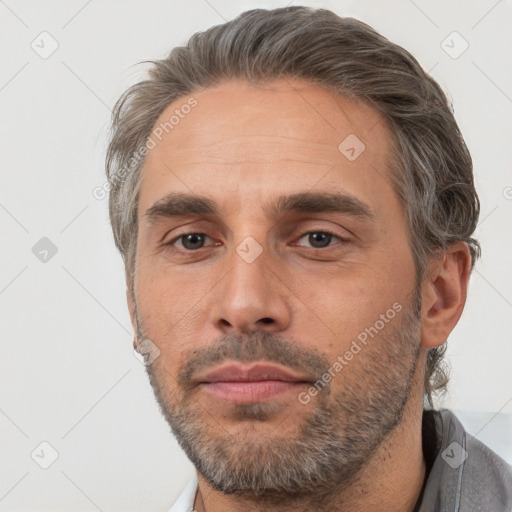 Neutral white adult male with short  brown hair and brown eyes