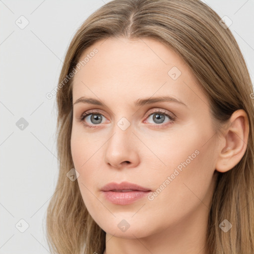 Neutral white young-adult female with long  brown hair and brown eyes