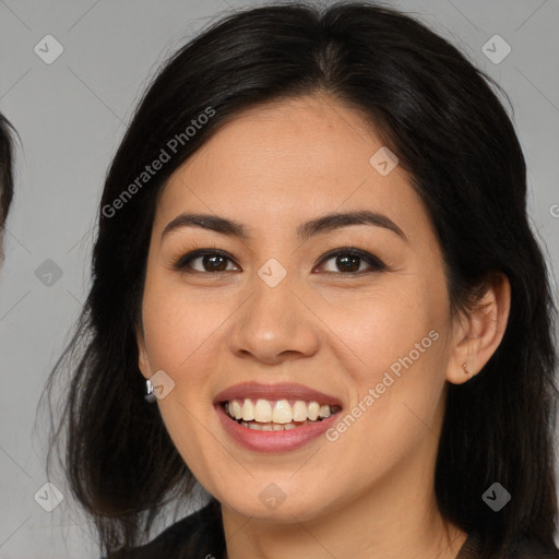 Joyful latino young-adult female with long  brown hair and brown eyes