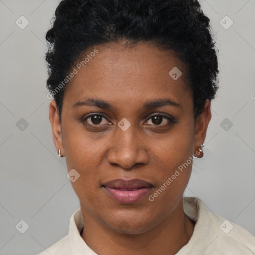 Joyful black young-adult female with short  black hair and brown eyes