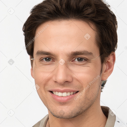 Joyful white young-adult male with short  brown hair and brown eyes