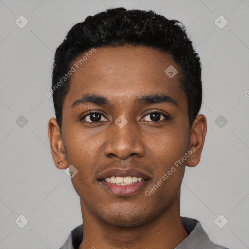 Joyful black young-adult male with short  black hair and brown eyes