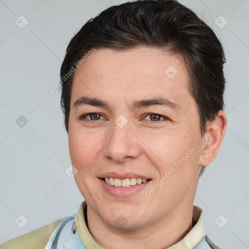 Joyful white adult male with short  brown hair and brown eyes