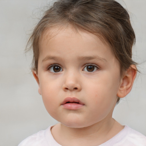 Neutral white child female with short  brown hair and brown eyes