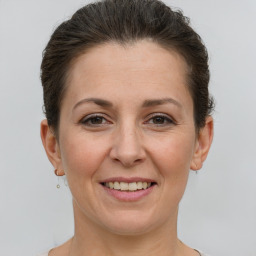 Joyful white adult female with short  brown hair and grey eyes