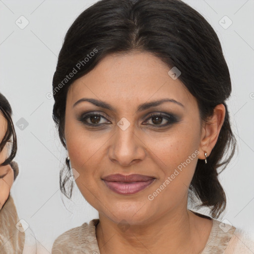 Joyful latino adult female with medium  brown hair and brown eyes