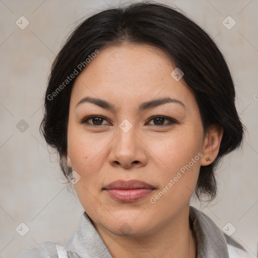 Joyful asian adult female with medium  brown hair and brown eyes