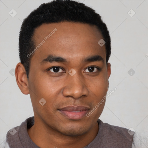 Joyful black young-adult male with short  black hair and brown eyes