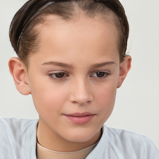 Joyful white child female with short  brown hair and brown eyes