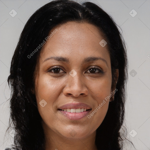 Joyful latino young-adult female with long  brown hair and brown eyes