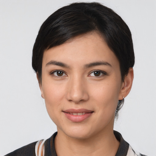 Joyful asian young-adult female with medium  black hair and brown eyes