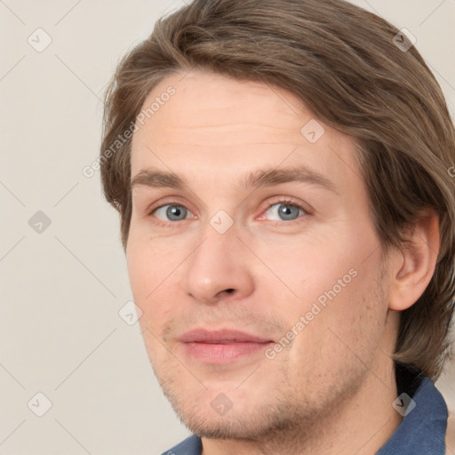 Joyful white adult male with short  brown hair and grey eyes