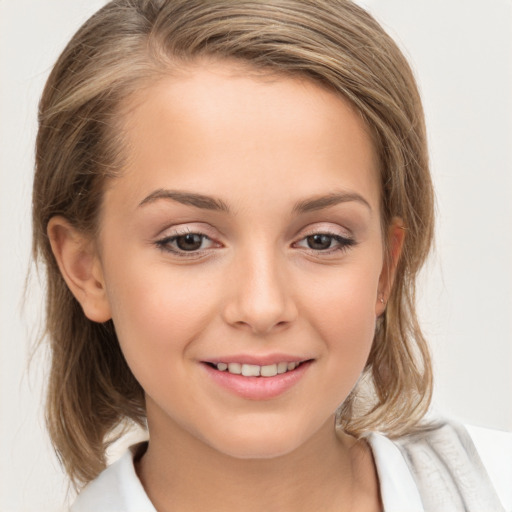 Joyful white child female with medium  brown hair and brown eyes