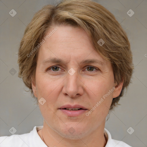 Joyful white adult female with medium  brown hair and brown eyes