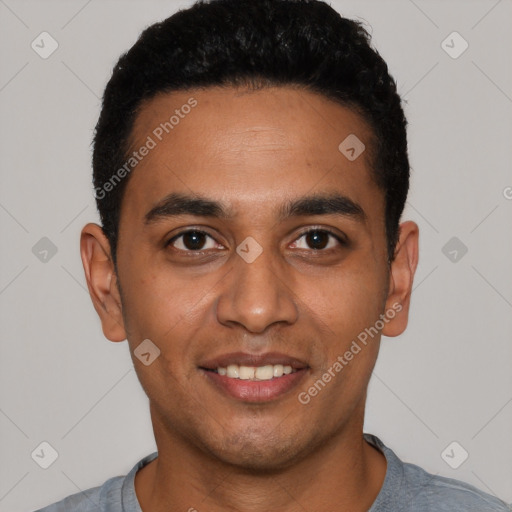 Joyful latino young-adult male with short  black hair and brown eyes