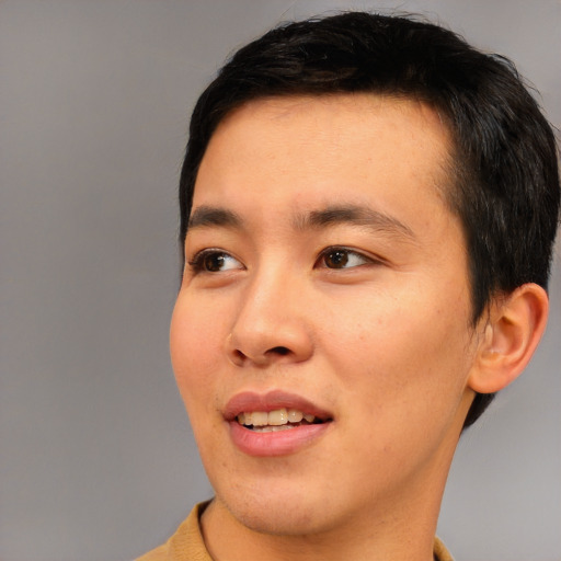 Joyful asian young-adult male with short  black hair and brown eyes