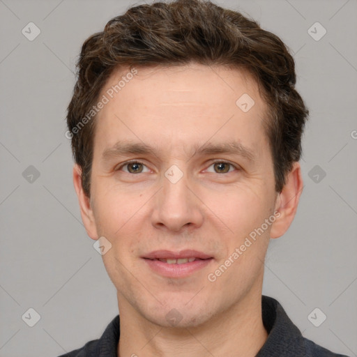 Joyful white adult male with short  brown hair and grey eyes