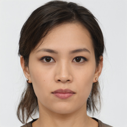 Neutral asian young-adult female with medium  brown hair and brown eyes