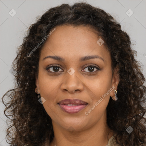 Joyful black young-adult female with long  brown hair and brown eyes