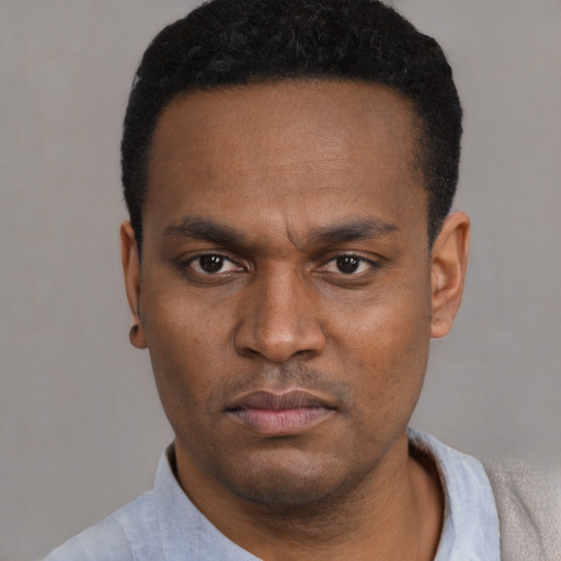 Neutral black young-adult male with short  black hair and brown eyes
