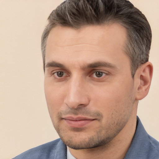 Joyful white adult male with short  brown hair and brown eyes