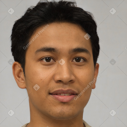 Joyful latino young-adult male with short  brown hair and brown eyes