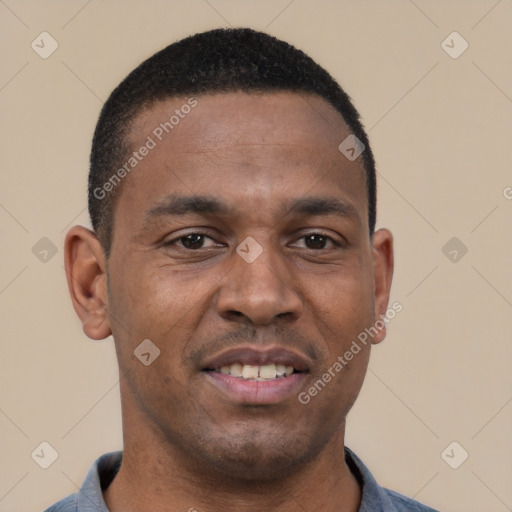 Joyful latino young-adult male with short  brown hair and brown eyes