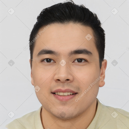 Joyful asian young-adult male with short  black hair and brown eyes