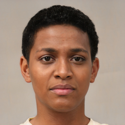Joyful black young-adult female with short  black hair and brown eyes
