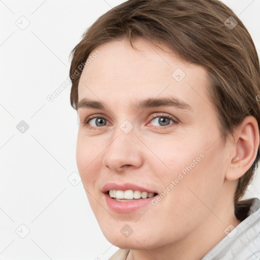 Joyful white young-adult female with short  brown hair and grey eyes