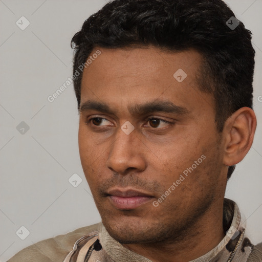 Neutral latino young-adult male with short  black hair and brown eyes
