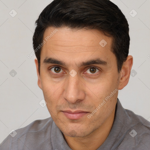 Joyful white adult male with short  brown hair and brown eyes