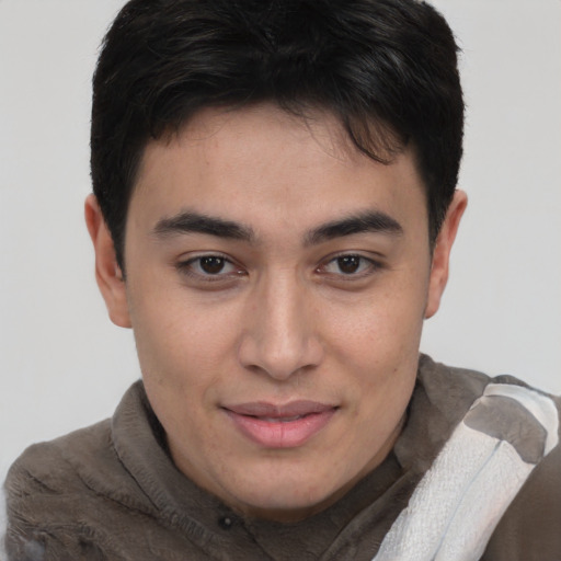 Joyful asian young-adult male with short  brown hair and brown eyes