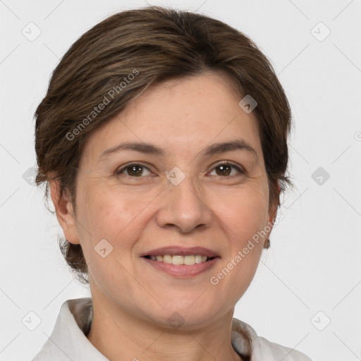 Joyful white adult female with medium  brown hair and grey eyes