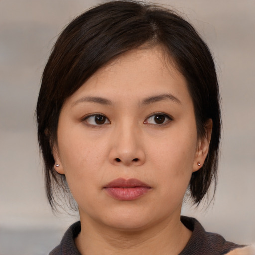 Neutral asian young-adult female with medium  brown hair and brown eyes