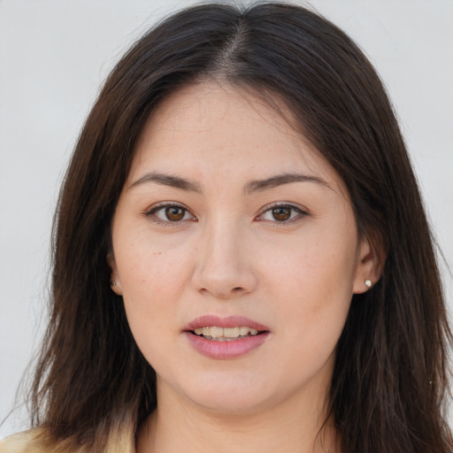 Joyful white young-adult female with long  brown hair and brown eyes