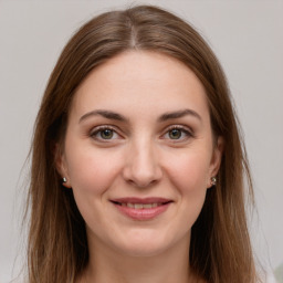 Joyful white young-adult female with long  brown hair and grey eyes