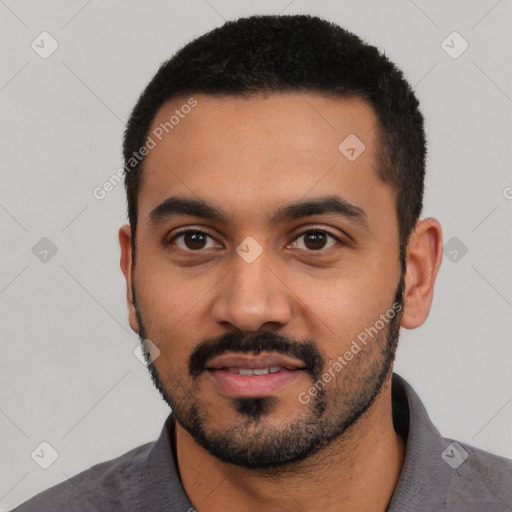 Neutral latino young-adult male with short  black hair and brown eyes