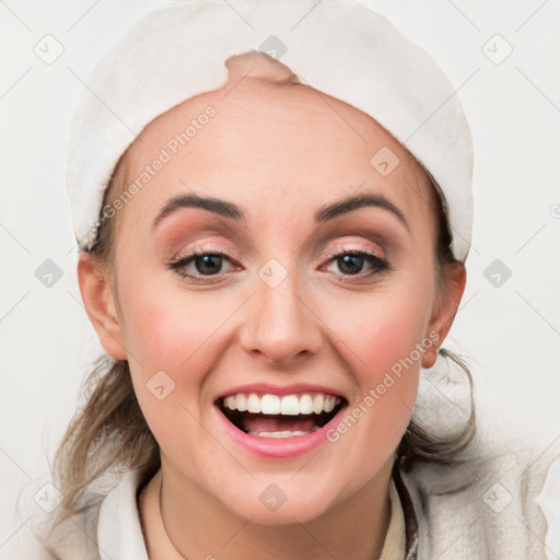 Joyful white young-adult female with medium  brown hair and blue eyes