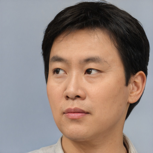 Neutral asian young-adult male with short  black hair and brown eyes