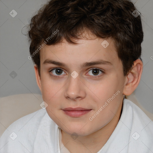 Joyful white child male with short  brown hair and brown eyes