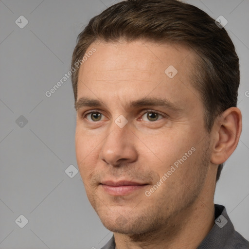 Joyful white adult male with short  brown hair and brown eyes