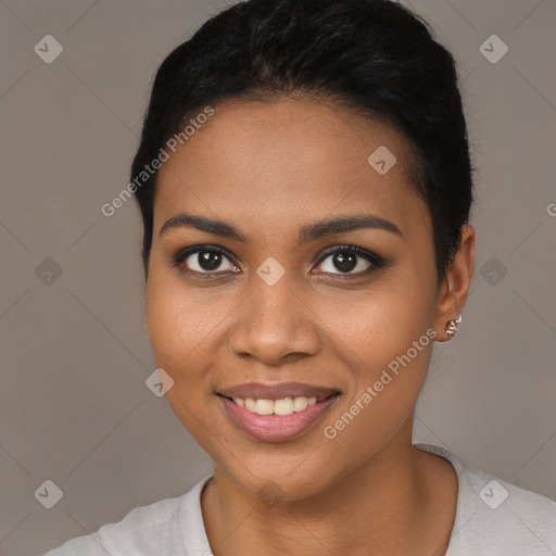 Joyful black young-adult female with short  black hair and brown eyes