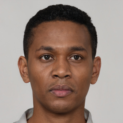 Neutral black young-adult male with short  brown hair and brown eyes